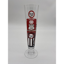 Load image into Gallery viewer, Tall slim Pilsner style beer glass wih red and black beer pump in the style of an american fuel pump.