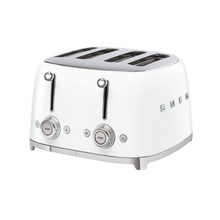 Load image into Gallery viewer, White Background. Smeg 50's Retro White 4 Slice Toaster. The body of the toaster is white with chrome letters S, M, E and G embossed on either side. The top, base, levers, knobs and buttons are all chrome. There are two push down levers, two browning knobs, two defrost, two reheat and two stop buttons. One for each set of 2 slots.