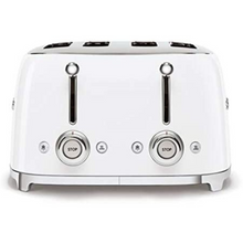 Load image into Gallery viewer, Side View. White Background. Smeg 50's Retro White 4 Slice Toaster. The body of the toaster is white with chrome letters S, M, E and G embossed on either side. The top, base, levers, knobs and buttons are all chrome. There are two push down levers, two browning knobs, two defrost, two reheat and two stop buttons. One for each set of 2 slots.