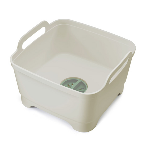 A stone white square bowl with handles and sage green removable plug for straining and draining.