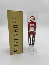 Load image into Gallery viewer, Tall slim Pilsner style beer glass wih red and black beer pump in the style of an american fuel pump. It&#39;s Ritzenhoff branded gift box is to its left.
