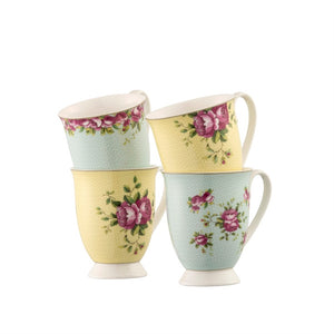 White Background. 4 Aynsley Archive Rose footed fine china mugs. 2 Yellow and 2 blue. All with pink roses, green leaves and a delicate circles all over the background colour. All handles are facing right.