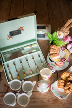 Load image into Gallery viewer, A collection of Aynsley Archive Rose pieces sitting on a wooden dining table and accented with pastries, cupcakes, tray bakes and an easter themed rabbit wearing glasses. Collection includes; 1 x Pastry Set, 1 Set of 4 Footed mugs, 1 Cream and sugar set. 1 2 tier cake stand and 1 sandwich tray.

