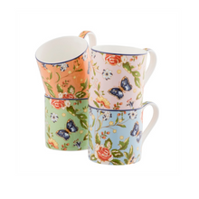 Load image into Gallery viewer, White background. 4 different coloured mugs. 1 pink. 1 blue. 1 coral. 1 green. All with a white interior and handle. All sporting a rose, daisy, leaves and blue butterflies pattern.

