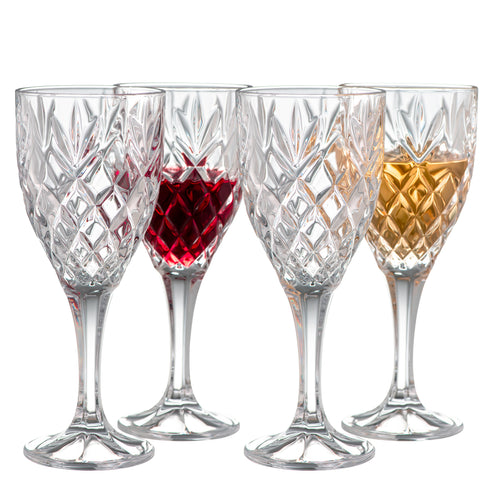 A set of  clear, traditionally cut wine glasses.