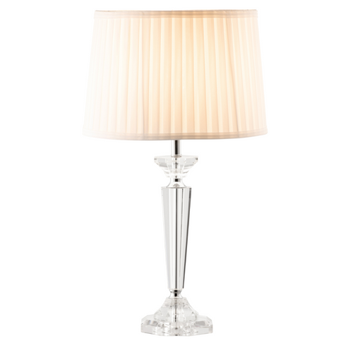 A modern based clear glass lamp with round, cream pleated shade.