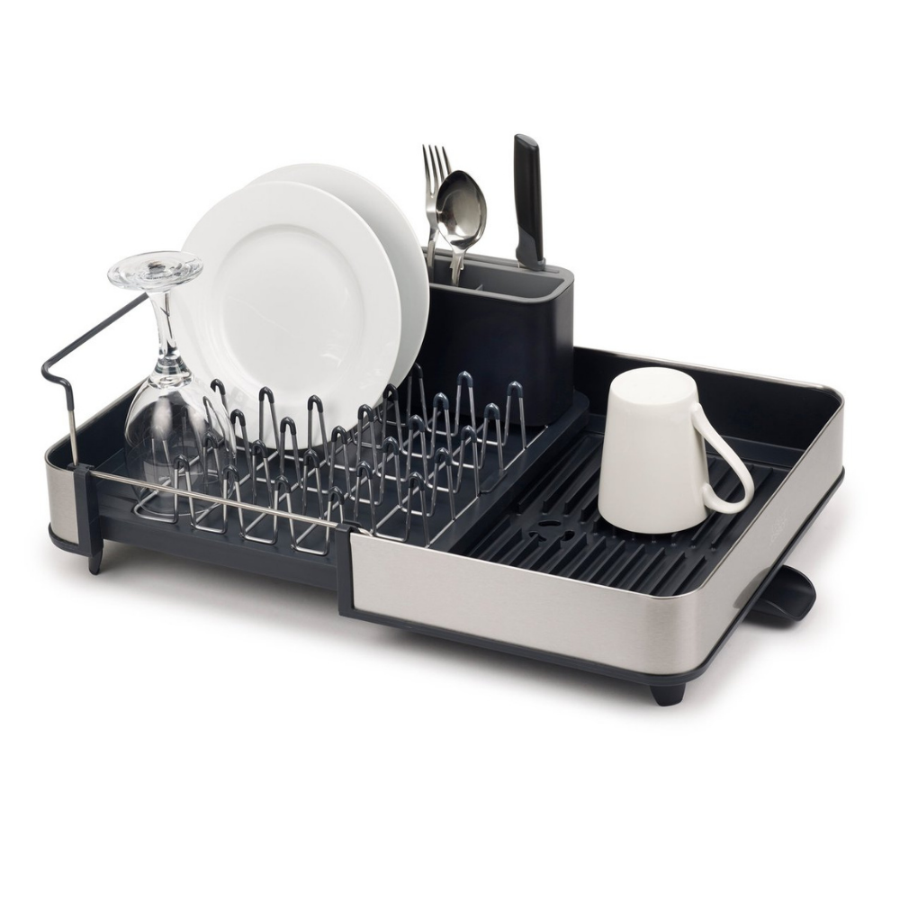 A Grey and Stainless Steel rectangular, expandable dish rack with cutlery hold. The picture shows how it can hold mugs, plates, glasses and cutlery. It also has a draining spout to easily drain away excess water.