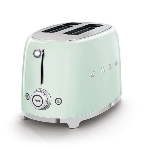 White Background. Smeg 50s Style Retro 2 Slice Toaster. The body is pastel green and it is chrome at the top and bottom. There are S M E and G chrome letters embossed on the front and the back. The push down lever, browning knob, defrost, reheat and stop button are chrome.