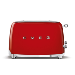 Front View. White Background. Smeg Red 50s Retro 2 Slice Toaster. The body of the toaster is red with chrome letters S, M, E and G embossed on both sides. The top and base are chrome. The push down lever, defrost, reheat, stop buttons and browning knob are all chrome.