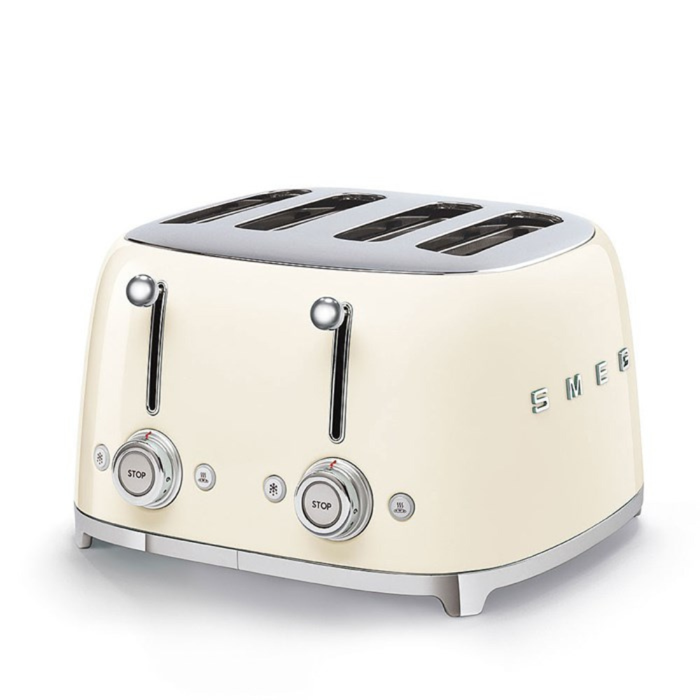 White Background. Smeg 50's Retro Cream 4 Slice Toaster. The body of the toaster is Cream with chrome letters S, M, E and G embossed on either side. The top, base, levers, knobs and buttons are all chrome. There are two push down levers, two browning knobs, two defrost, two reheat and two stop buttons. One for each set of 2 slots.