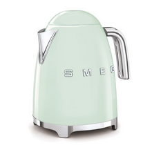 Load image into Gallery viewer, White Background. Smeg 50s Retro 1.7L Kettle. The body of the kettle is Pastel Green. There are chrome letters S, M, E and G embossed on each side. The lid is push button release. The spout, Handle, on/off lever and base are chrome. There is a water level window in line with the handle.
