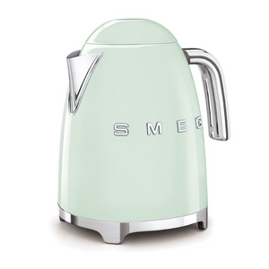 White Background. Smeg 50s Retro 1.7L Kettle. The body of the kettle is Pastel Green. There are chrome letters S, M, E and G embossed on each side. The lid is push button release. The spout, Handle, on/off lever and base are chrome. There is a water level window in line with the handle.
