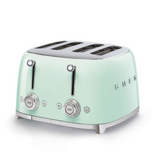 Load image into Gallery viewer, White Background. Smeg 50&#39;s Retro Pastel Green 4 Slice Toaster. The body of the toaster is Pastel Green with chrome letters S, M, E and G embossed on either side. The top, base, levers, knobs and buttons are all chrome. There are two push down levers, two browning knobs, two defrost, two reheat and two stop buttons. One for each set of 2 slots.
