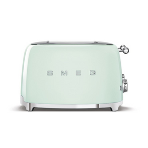 Front View. White Background. Smeg 50's Retro Pastel Green 4 Slice Toaster. The body of the toaster is Pastel Green with chrome letters S, M, E and G embossed on either side. The top, base, levers, knobs and buttons are all chrome. There are two push down levers, two browning knobs, two defrost, two reheat and two stop buttons. One for each set of 2 slots.