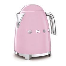 Load image into Gallery viewer, White Background. Smeg 50s Retro 1.7L Kettle. The body of the kettle is Pink. There are chrome letters S, M, E and G embossed on each side. The lid is push button release. The spout, Handle, on/off lever and base are chrome. There is a water level window in line with the handle.
