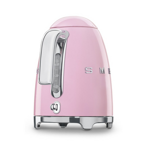 Handle View. White Background. Smeg 50s Retro 1.7L Kettle. The body of the kettle is Pink. There are chrome letters S, M, E and G embossed on each side. The lid is push button release. The spout, Handle, on/off lever and base are chrome. There is a water level window in line with the handle.