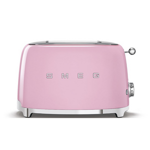 Front view. White Background. Smeg Pink 50s Retro 2 Slice Toaster. The body of the toaster is pink with chrome letters S, M, E and G embossed on both sides. The top and base are chrome. The push down lever, defrost, reheat, stop buttons and browning knob are all chrome.