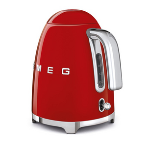 Rear Side View.White Background. Smeg 50s Retro 1.7L Kettle. The body of the kettle is Red. There are chrome letters S, M, E and G embossed on each side. The lid is push button release. The spout, Handle, on/off lever and base are chrome. There is a water level window in line with the handle.
