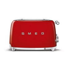 Load image into Gallery viewer, Front View. White Background. Smeg 50&#39;s Retro Red 4 Slice Toaster. The body of the toaster is Red with chrome letters S, M, E and G embossed on either side. The top, base, levers, knobs and buttons are all chrome. There are two push down levers, two browning knobs, two defrost, two reheat and two stop buttons. One for each set of 2 slots.
