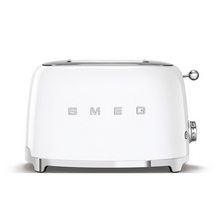 Load image into Gallery viewer, Front View. White Background. Smeg White 50s Retro 2 Slice Toaster. The body of the toaster is white with chrome letters S, M, E and G embossed on both sides. The top and base are chrome. The push down lever, defrost, reheat, stop buttons and browning knob are all chrome.
