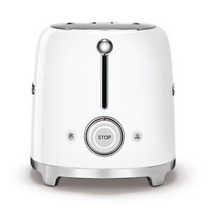 Side View. White Background. Smeg White 50s Retro 2 Slice Toaster. The body of the toaster is white with chrome letters S, M, E and G embossed on both sides. The top and base are chrome. The push down lever, defrost, reheat, stop buttons and browning knob are all chrome.
