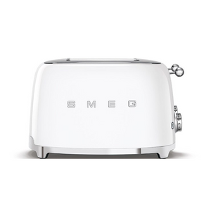 Front View. White Background. Smeg 50's Retro White 4 Slice Toaster. The body of the toaster is white with chrome letters S, M, E and G embossed on either side. The top, base, levers, knobs and buttons are all chrome. There are two push down levers, two browning knobs, two defrost, two reheat and two stop buttons. One for each set of 2 slots.