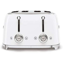 Load image into Gallery viewer, Side View. White Background. Smeg 50&#39;s Retro White 4 Slice Toaster. The body of the toaster is white with chrome letters S, M, E and G embossed on either side. The top, base, levers, knobs and buttons are all chrome. There are two push down levers, two browning knobs, two defrost, two reheat and two stop buttons. One for each set of 2 slots.

