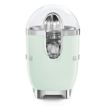 Load image into Gallery viewer, White background. The Smeg 50s Retro Citrus juicer. The body is pastel green. The reamer, spout and base are chrome. There is a clear dome over the top of the reamer. There are chrome letters S, M, E and G embossed on either side.
